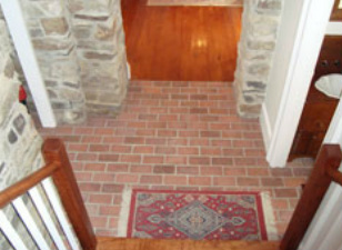 Picture brick floor tile in entry with stone walls